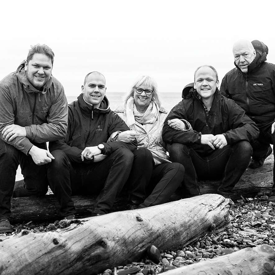 Wasmuth brothers, Andrew, James and Matthew co-founders of PetKind, with their mum and Dad by the beach. 
